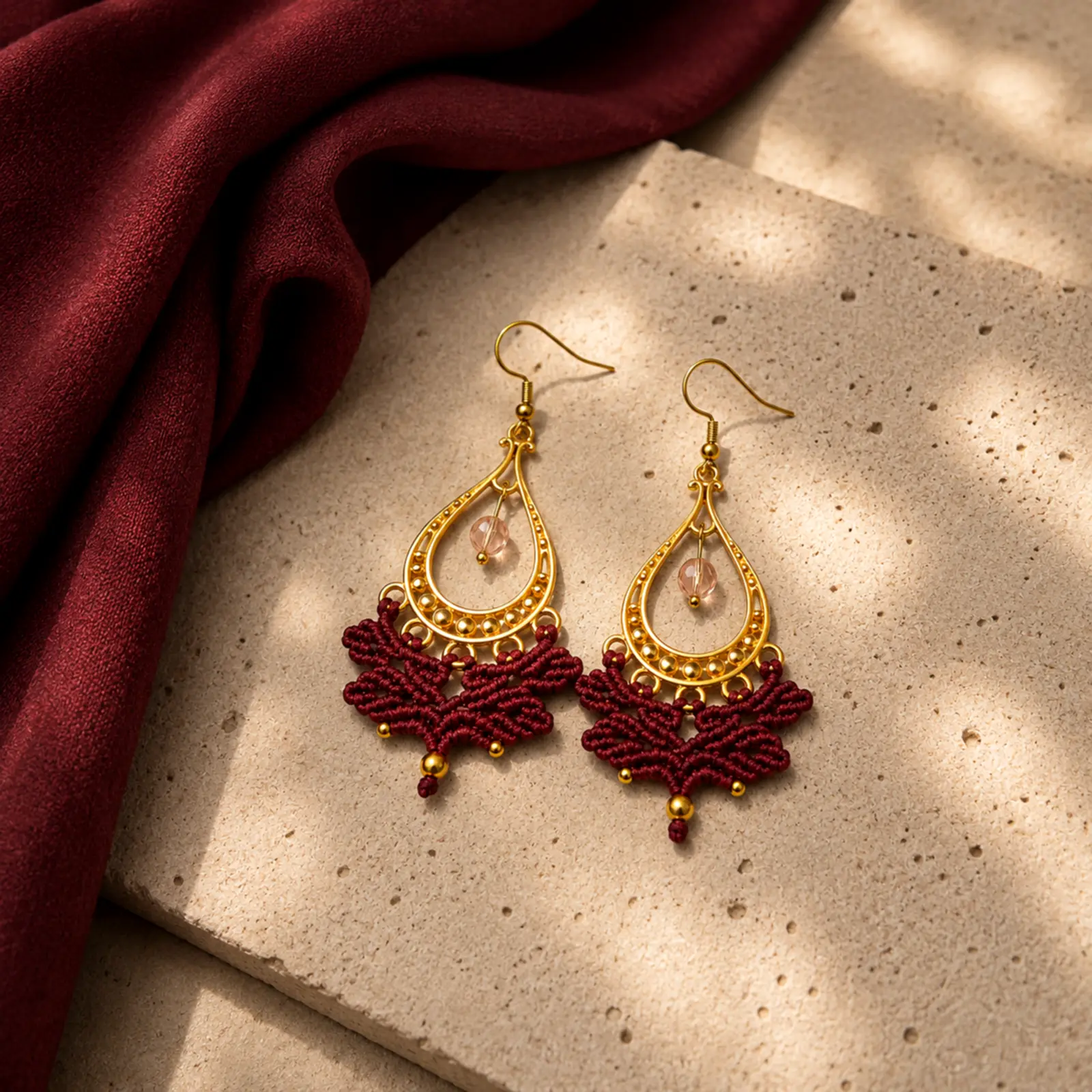 Handmade Macramé Earrings Pearl Drop in Deep Wine Red and Gold. Styled Image.